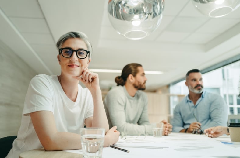 a group of people sitting at a table