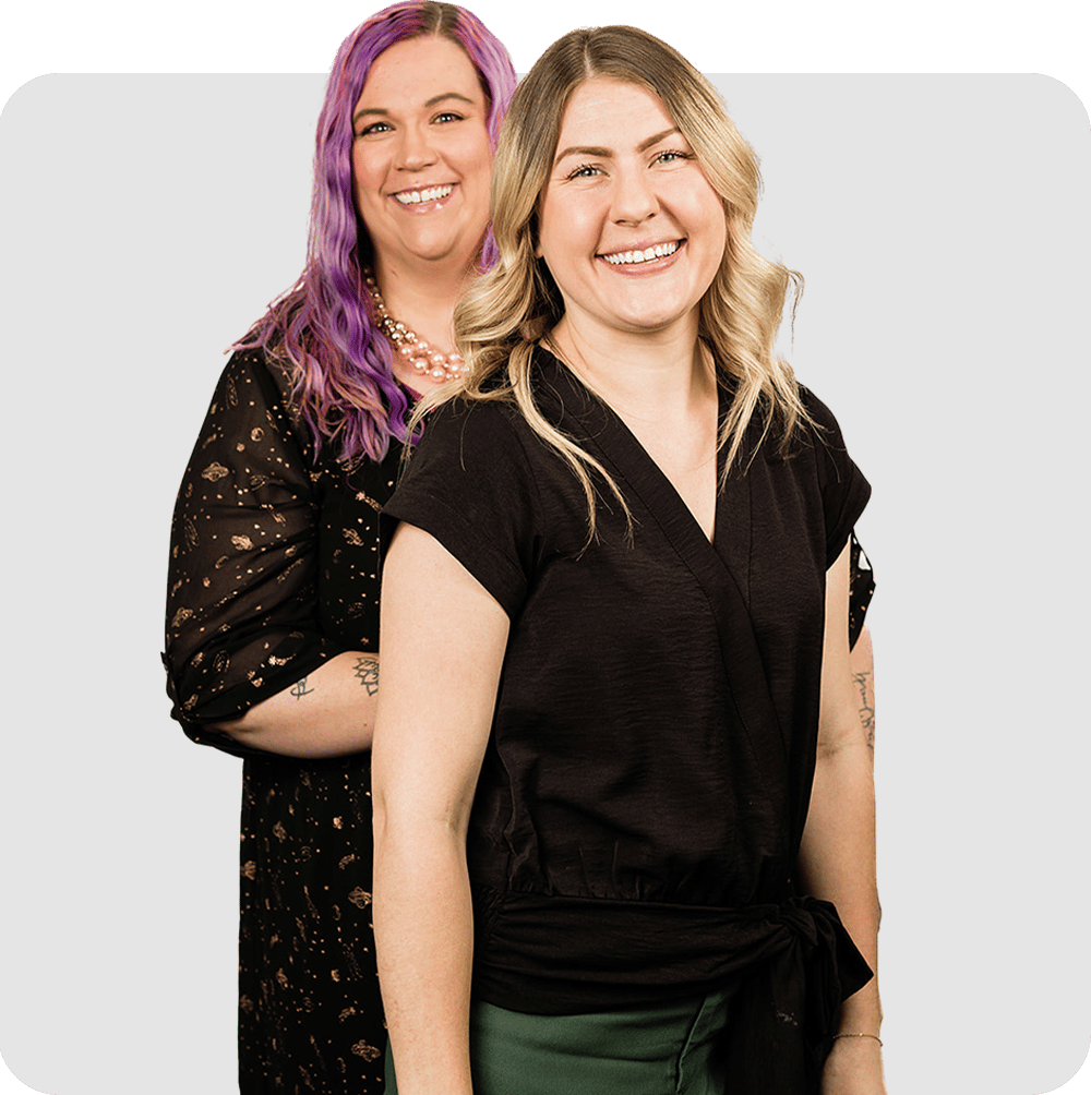 Two professional women posing together