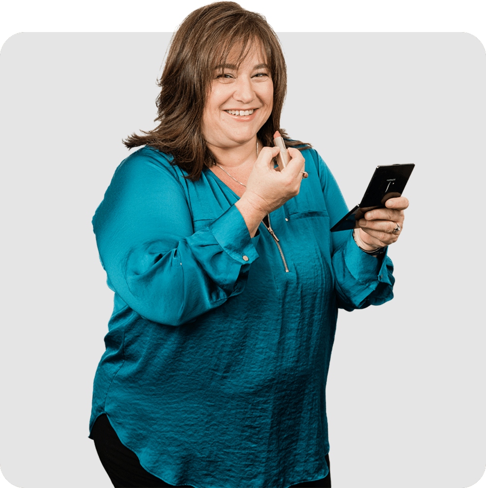 a woman holding a cell phone