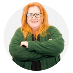 a woman wearing glasses and smiling at the camera Mary Ann Fisher